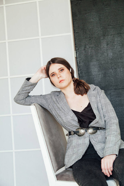 Portrait of a beautiful fashionable stylish woman in a sweater - Fotoğraf, Görsel