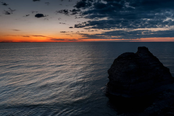 Sunset. Coastal limestone formations, raukar, at Byrum at the swedish island Oland, the island of sun and wind in the Baltic Sea - Zdjęcie, obraz