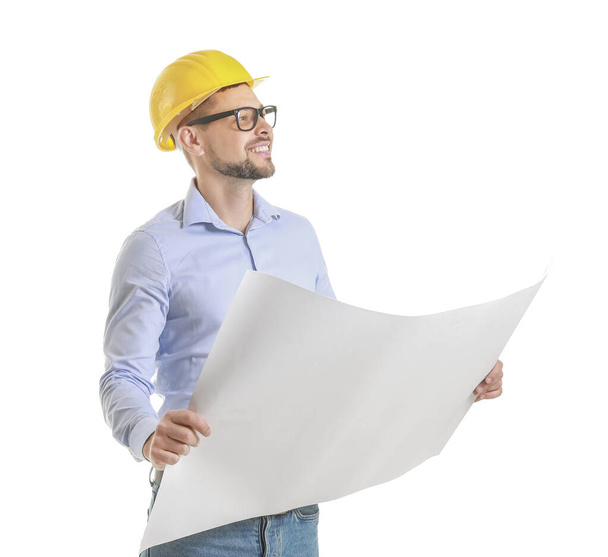 Männlicher Ingenieur mit Zeichnung auf weißem Hintergrund - Foto, Bild