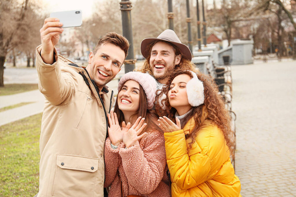 Happy friends taking selfie outdoors - Photo, Image