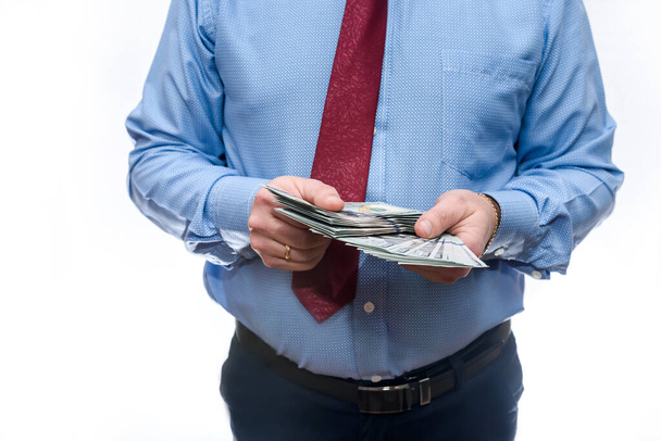 Man in suit holding dollar banknotes close up - Fotoğraf, Görsel