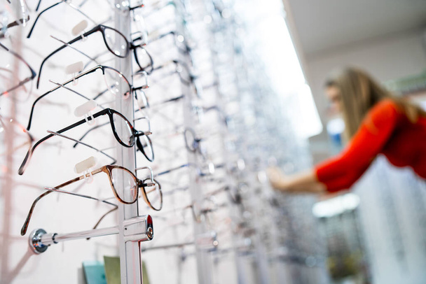 Prescription glasses for sale and on display at an optician's office. - Foto, Imagen