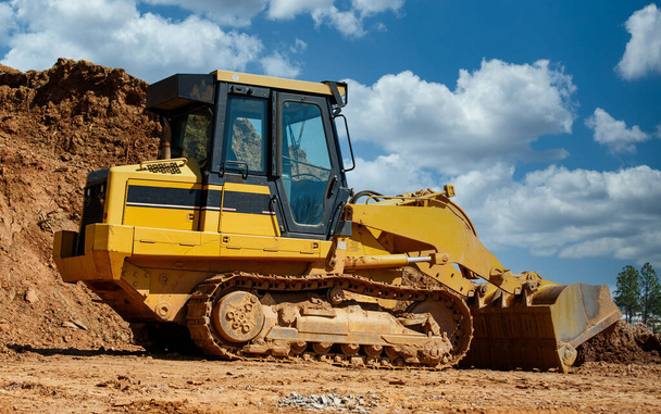 Earth Mover by Pile of Dirt - Photo, Image