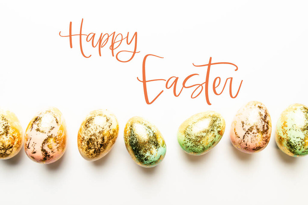 Huevos de Pascua moteados dorados naturales
 - Foto, imagen