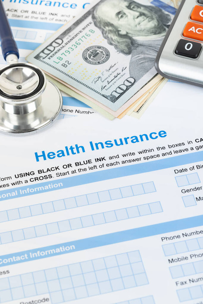 Health insurance application form with stethoscope and calculator - Φωτογραφία, εικόνα