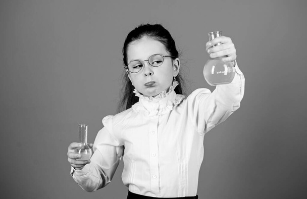 science research in lab. Small school girl. child study bilogy lesson. back to school. education and knowledge. small smart girl with testing flask. Testing samples. Concentrated on cure - Foto, Bild