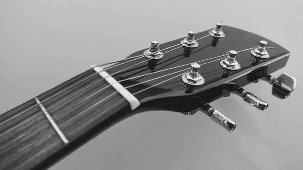 black guitar neck and headstock with copy space . black and white - 写真・画像
