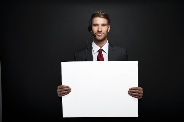 businessman holding banner with copy space - Photo, Image