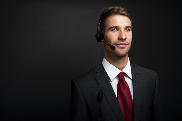 Smiling customer service operator. Over white background - Photo, image