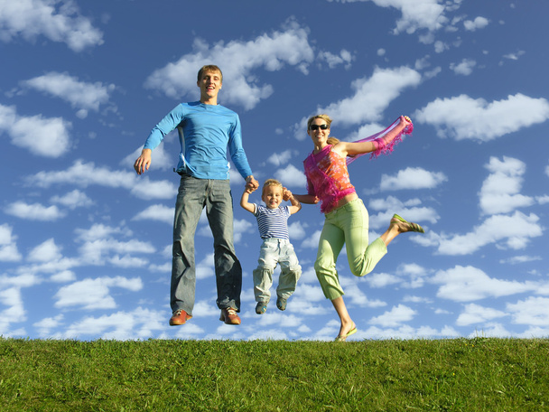 Fly happy family on blue sky with clouds - Fotoğraf, Görsel