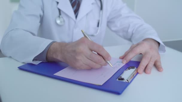 Oncologist filling rx form, prescribing medication for sick patient, healthcare - Filmagem, Vídeo