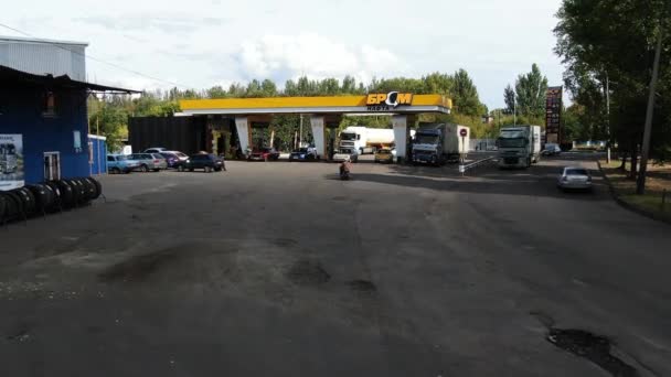 gas station in Dnipro, Ukraine, BRSM gas station, shooting from above, summer. aerial top view panoramic drone copter fly sky footage video - Footage, Video