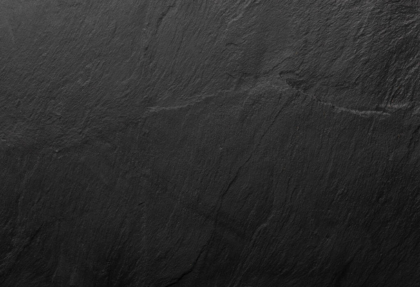 Black slate texture in which the grain of the mineral can be seen. Empty table for cheeses and other snacks. Copyspace (Copy space). - Zdjęcie, obraz