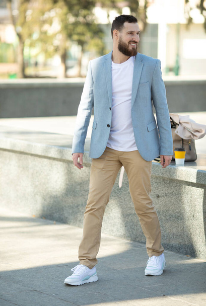 Young handsome attractive bearded model man in urban context. - 写真・画像