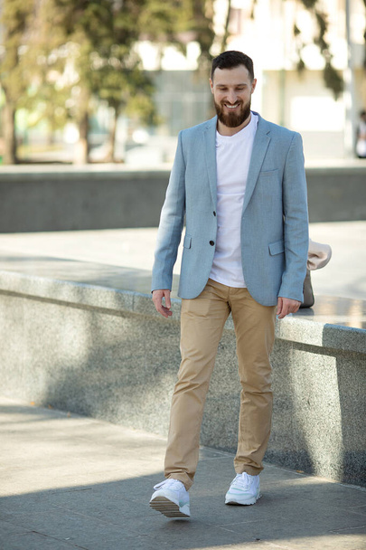 Cool handsome guy with beard smiling. - 写真・画像