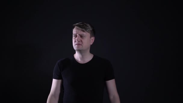 Surprised says What? a man in a black t-shirt - Filmagem, Vídeo