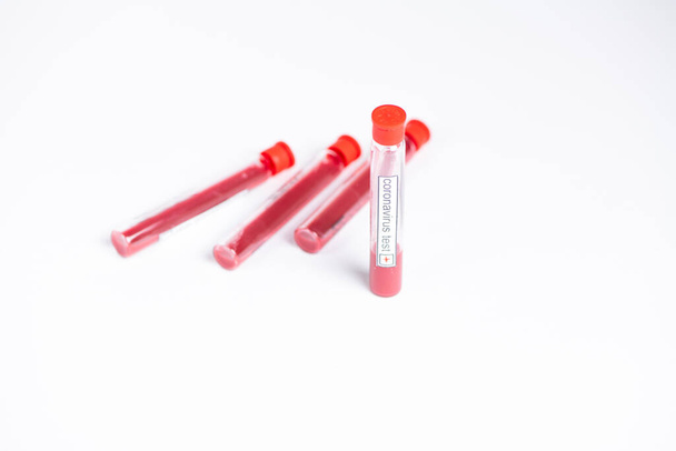 coronavirus emergency coronavirus test tube with blood on white - Fotoğraf, Görsel
