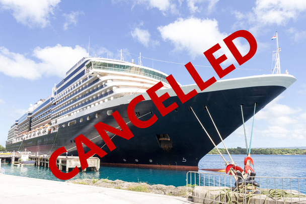 Cruise ship moored in port overlayed with stop sign showing called due to corona virus or covid-19 pandemic - Photo, Image