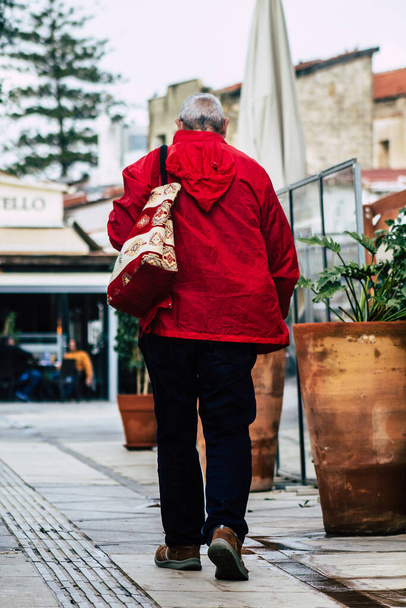 Limassol Cyprus March 13, 2020 View of unidentified tourist walking in the streets of Limassol in the afternoon - 写真・画像