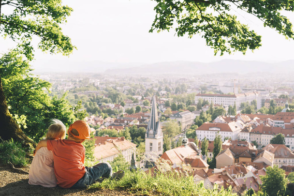 Little children on background of Ljubljana, Slovenia, Europe. Family outdoor - 写真・画像