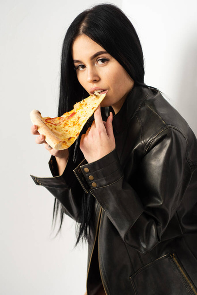 Best food is eaten with your hands. Sensual woman bite pizza slice. Pretty girl eat baked food. Ready to eat food. Pizzeria menu. Pizza shop. Italian style of food. Order now - 写真・画像