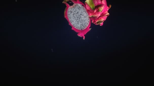 Falling half of dragon fruit in the water - Footage, Video