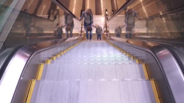 People climb the escalator at the airport. Escalator at the airport is moving up. - 映像、動画
