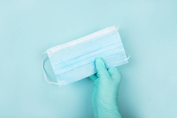 Flatlay with medical personal protective equipment for colds and flu prevention isolated on blue background. - 写真・画像