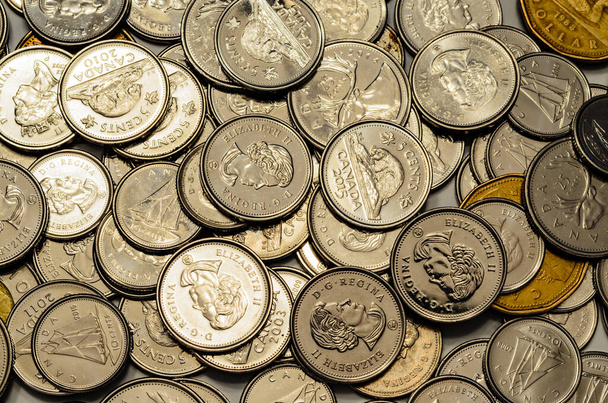 Overhead Closeup of Canadian silver Coins and Loonies spread out - Photo, Image