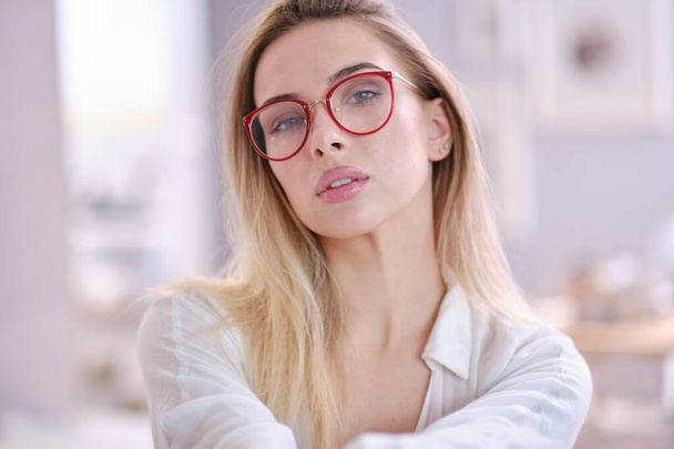 Cute young business woman with glasses - Fotó, kép