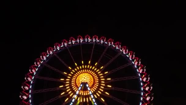 Ferris wheel as abstraction with glowing lights on black background at night, high contrast geometric abstraction on black background - Footage, Video