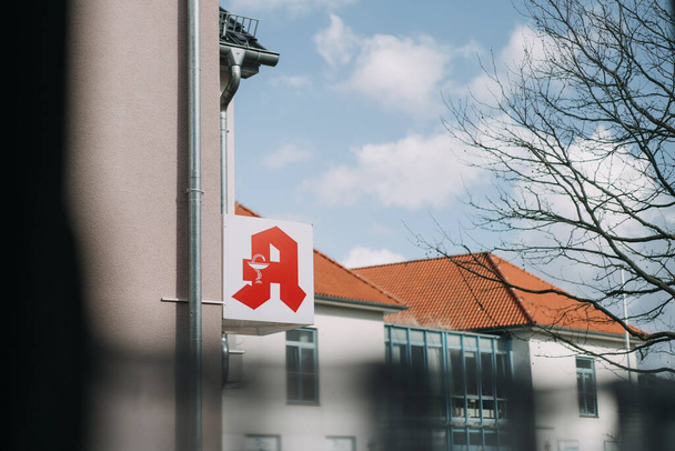 sign with logo of German pharmacy outside at building - Photo, Image