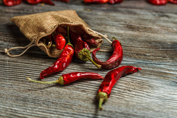 mexican food. dried red hot chilli pepper on wooden background. spicy taste. - Fotografie, Obrázek