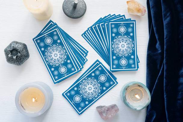 Tarot cards on the white wooden table background. - Φωτογραφία, εικόνα