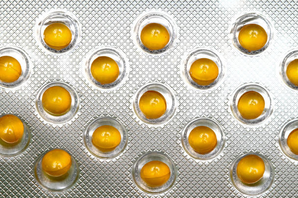 Yellow pills - Фото, зображення