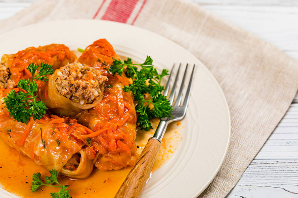 Stuffed Cabbage Rolls on Vintage Wooden Background. Selective focus. - Foto, immagini