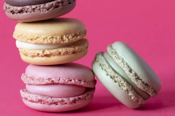 Closeup shot of stack of macaroons on pink background - Photo, Image