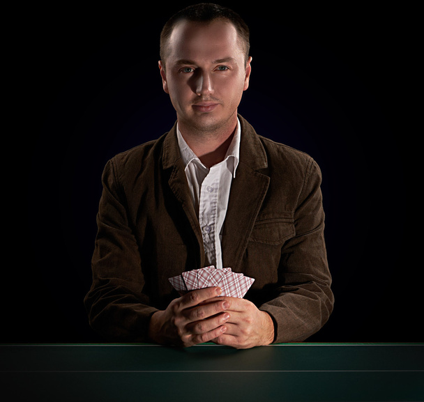 Poker player on a dark background - Zdjęcie, obraz