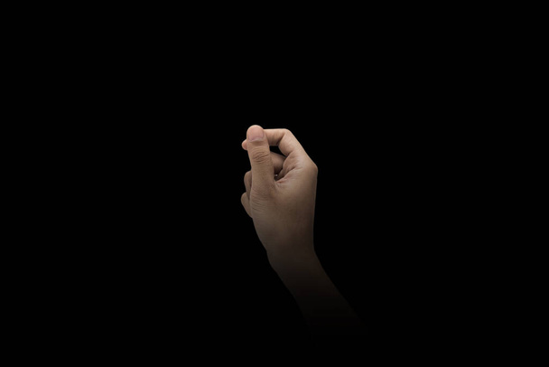 Male hand finger sign over dark background - Φωτογραφία, εικόνα