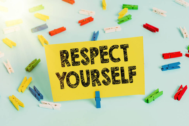 Text sign showing Respect Yourself. Conceptual photo believing that you good and worthy being treated well Colored clothespin papers empty reminder blue floor background office pin. - Foto, Bild