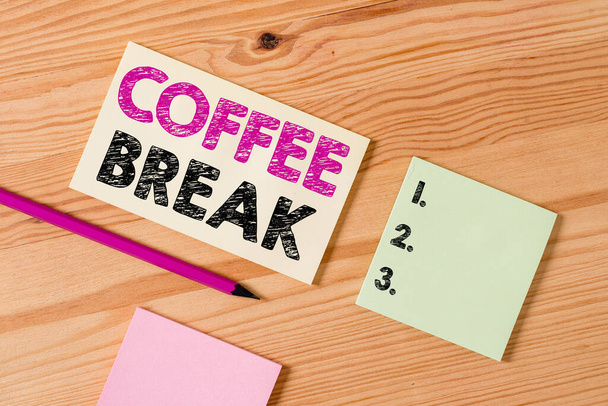 Text sign showing Coffee Break. Conceptual photo short time when you stop working to have a cup of coffee Colored clothespin papers empty reminder wooden floor background office. - Zdjęcie, obraz