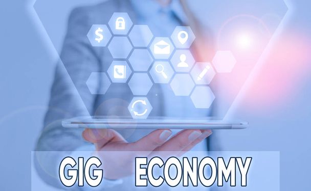 Writing note showing Gig Economy. Business photo showcasing free market system in which temporary positions are common. - Photo, Image