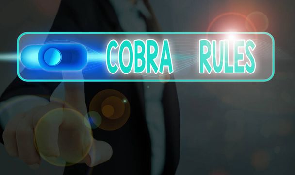 Tekstiä kirjoittava teksti Cobra Rules. Liiketoiminta-ajatus ryhmän sairausvakuutuksen jatkumisesta työpaikan menetyksen jälkeen
. - Valokuva, kuva