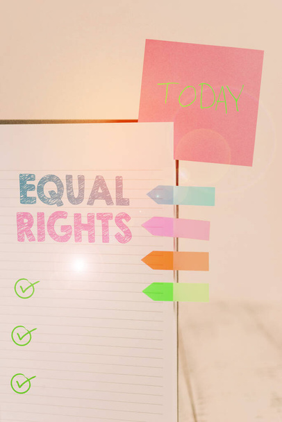 Writing note showing Equal Rights. Business photo showcasing Equality before the law when all showing have the same rights Hard cover note book sticky note arrow banner inserted clear background. - Foto, afbeelding