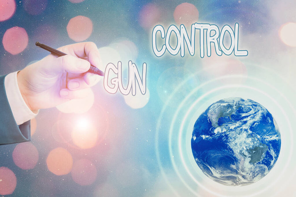 Conceptual hand writing showing Gun Control. Business photo text legal measure intended to restrict the possession of guns Elements of this image furnished by NASA. - Photo, Image