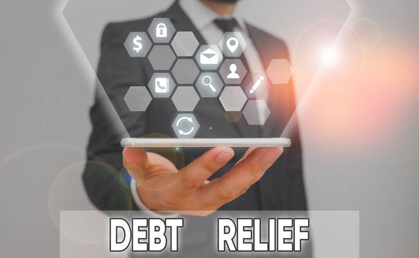 Conceptual hand writing showing Debt Relief. Business photo showcasing a reduction in the amount of debt that a country has to pay. - Photo, Image