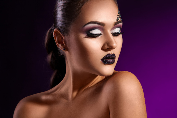 Sensual portrait of elegance adult woman on purple background - Photo, Image