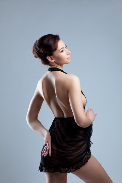Pretty model with perfect skin advertises negligee - Valokuva, kuva