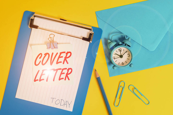 Writing note showing Cover Letter. Business photo showcasing document explaining the applicant s is credentials and interest Clipboard sheet note pencil clips clock envelop colored background. - Photo, Image