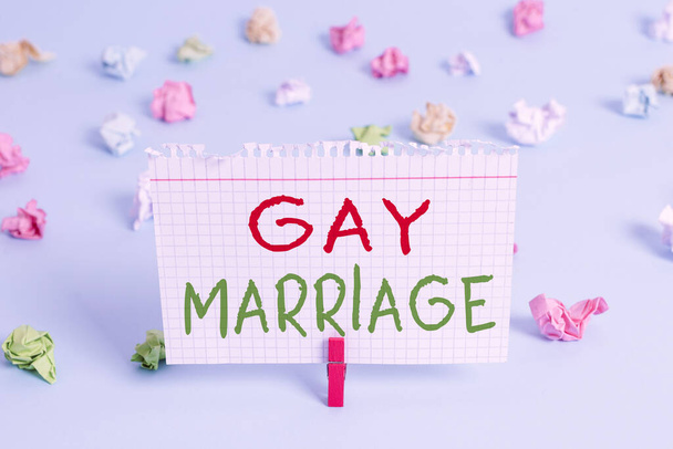 Word writing text Gay Marriage. Business concept for entered into in a civil or religious ceremony of the same sex Colored crumpled rectangle shaped reminder paper light blue background. - Photo, Image